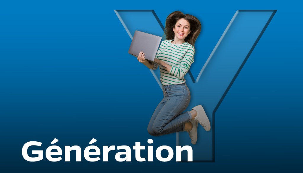 Generation Y - Jeune femme qui saute avec un ordinateur portable à la main devant un grand Y