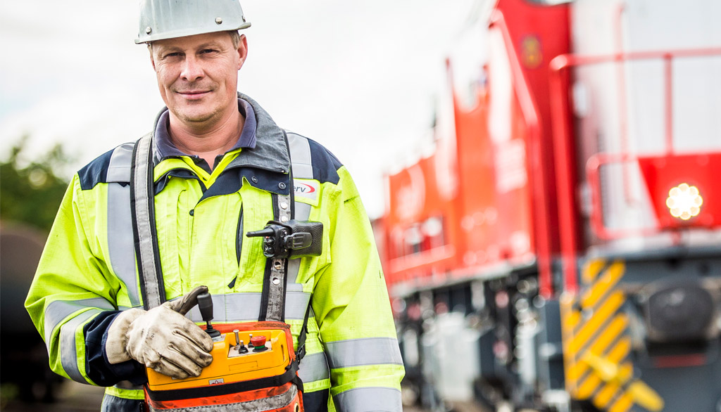 LogServ image with a worker in the front and a train in the back